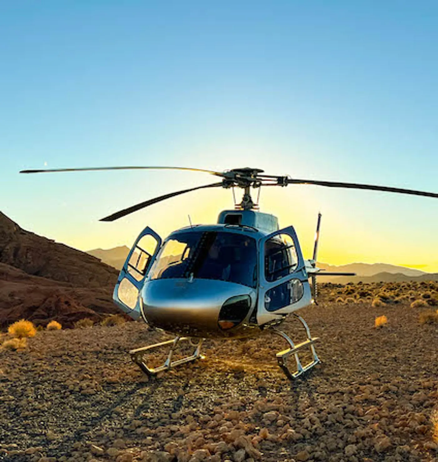 View from the cockpit over the desert with the pilot in headset