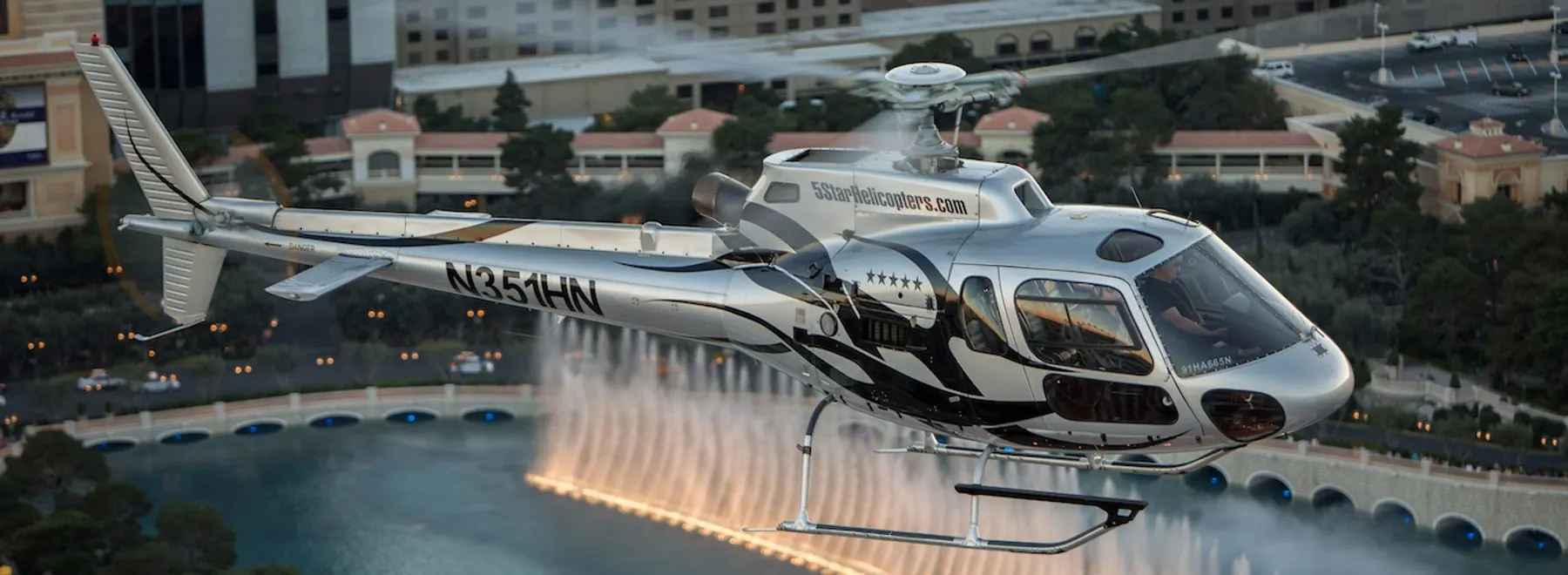 5 Star helicopter over the Bellagio fountains on the Las Vegas Strip